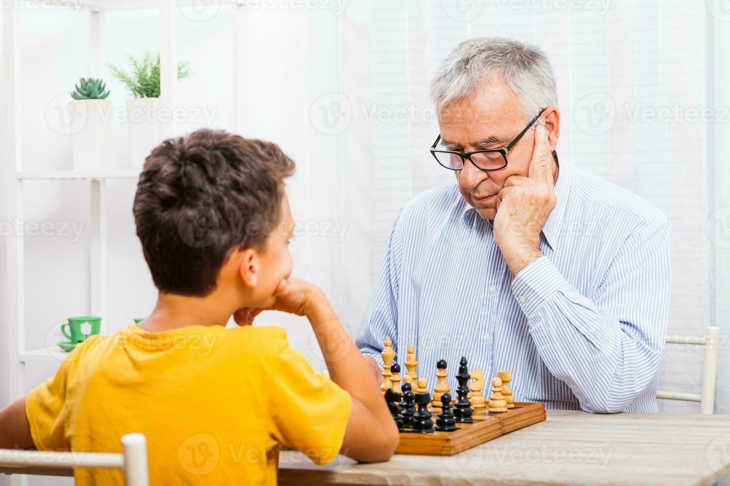 A grandfather spending time with his grandson photo