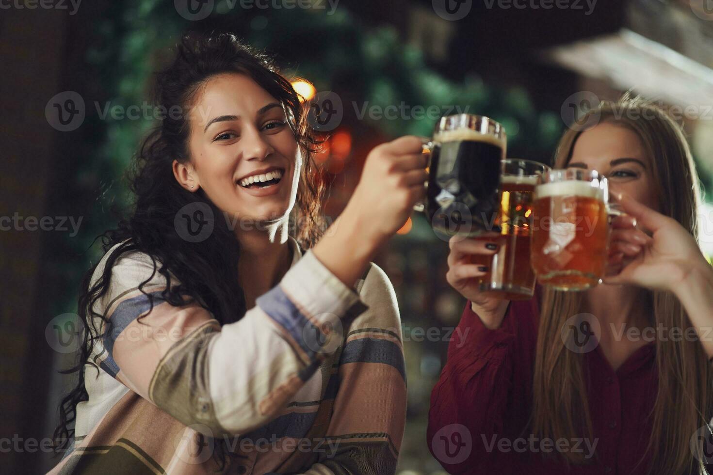 Friends having fun at the bar photo