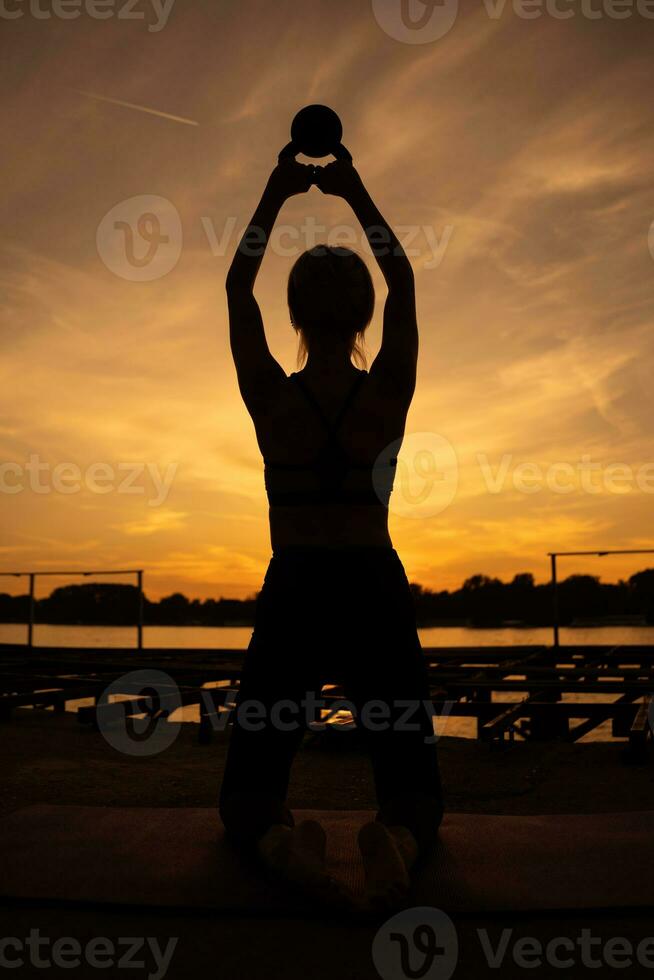 A woman doing physical exercises photo