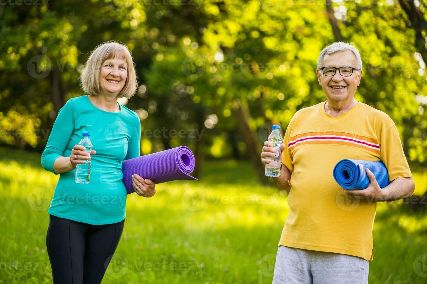 A senior couple doing physical exercises photo