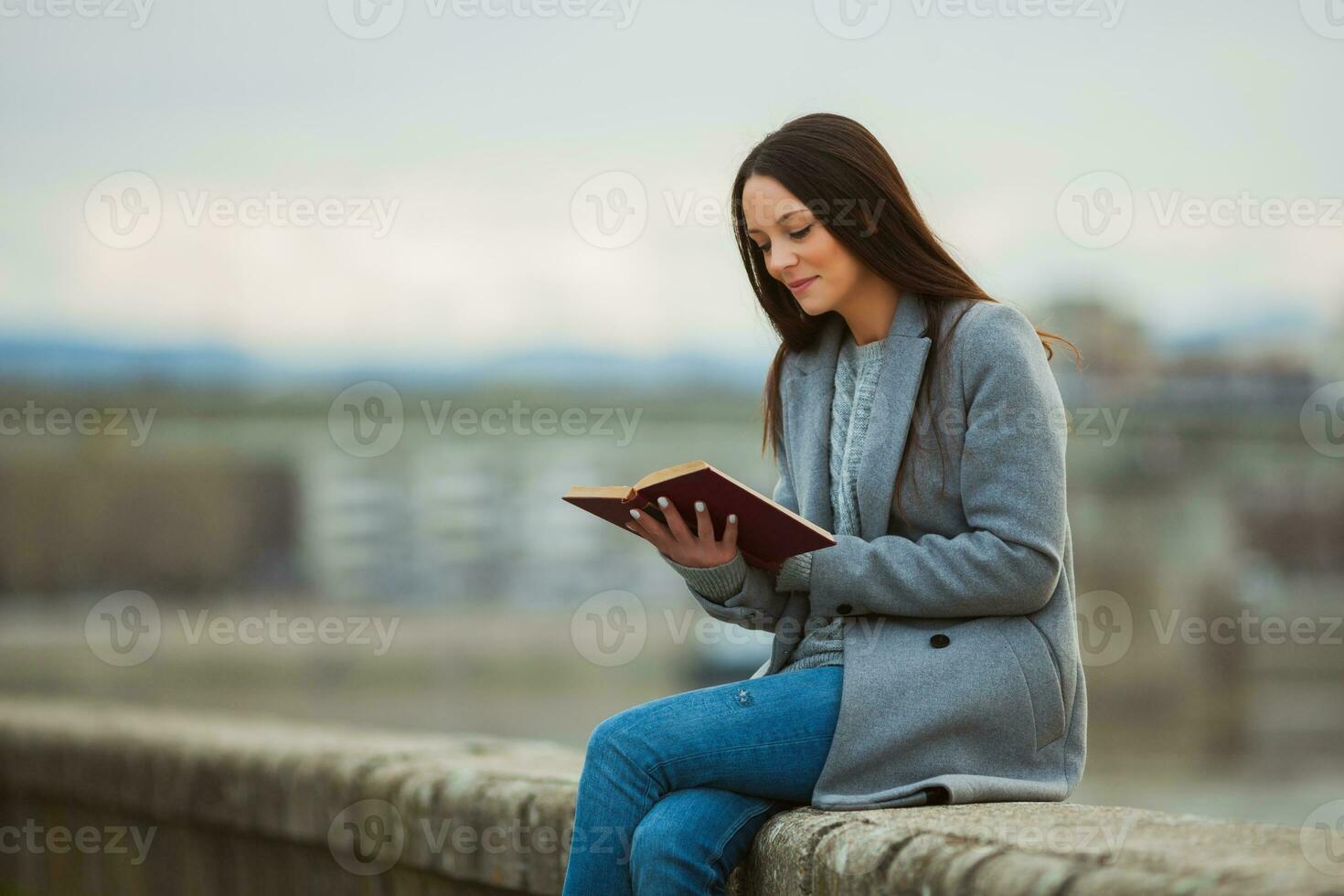 A woman spending time outside, in the city photo