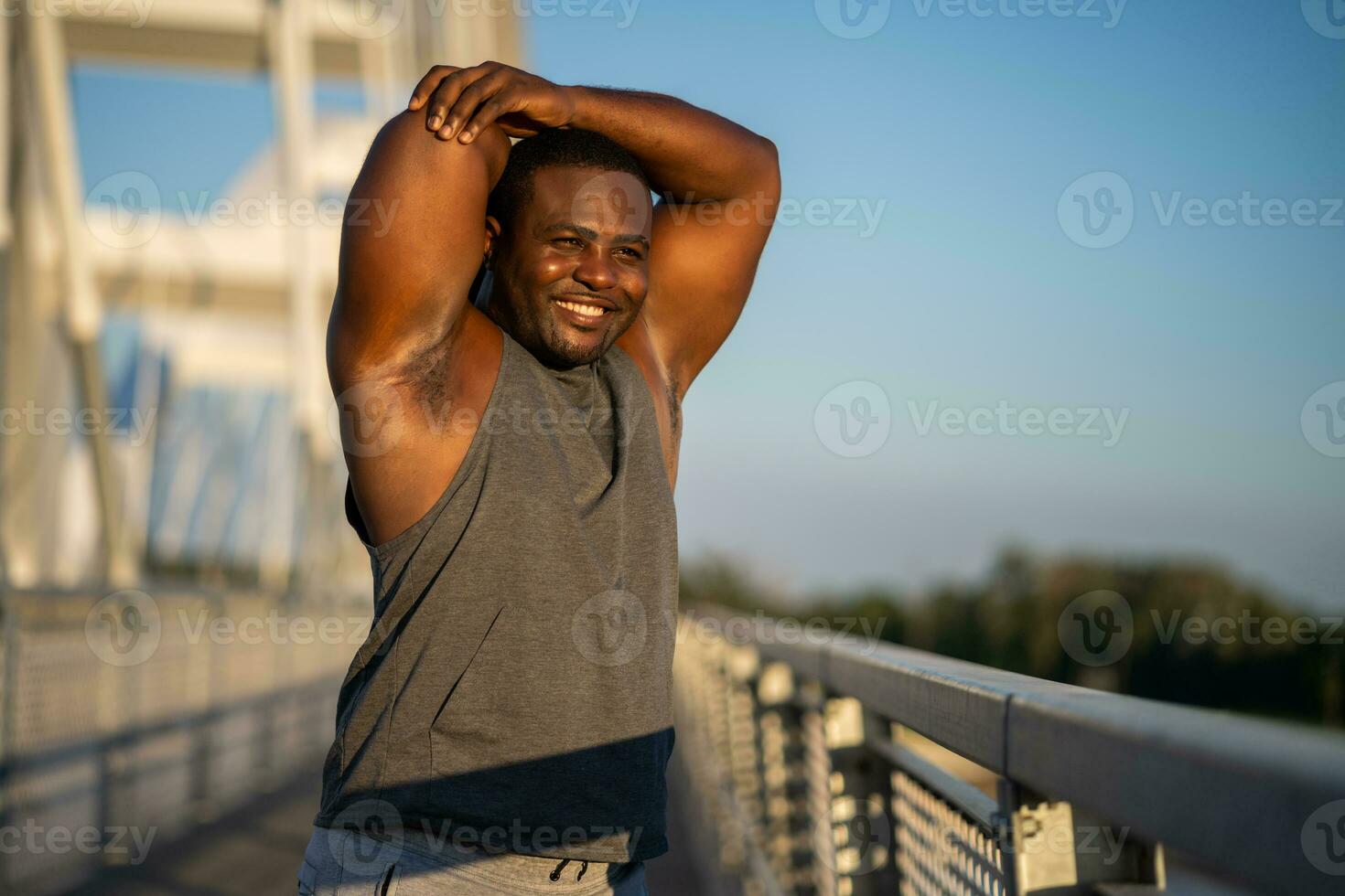 An African American man doing physical exercises photo