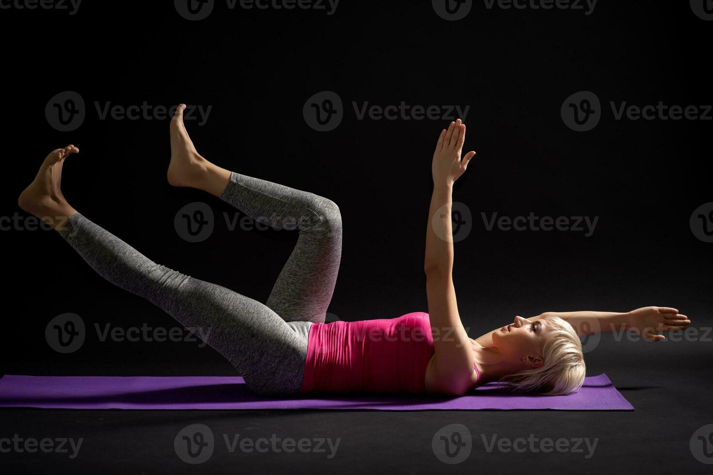 A woman doing physical exercises photo