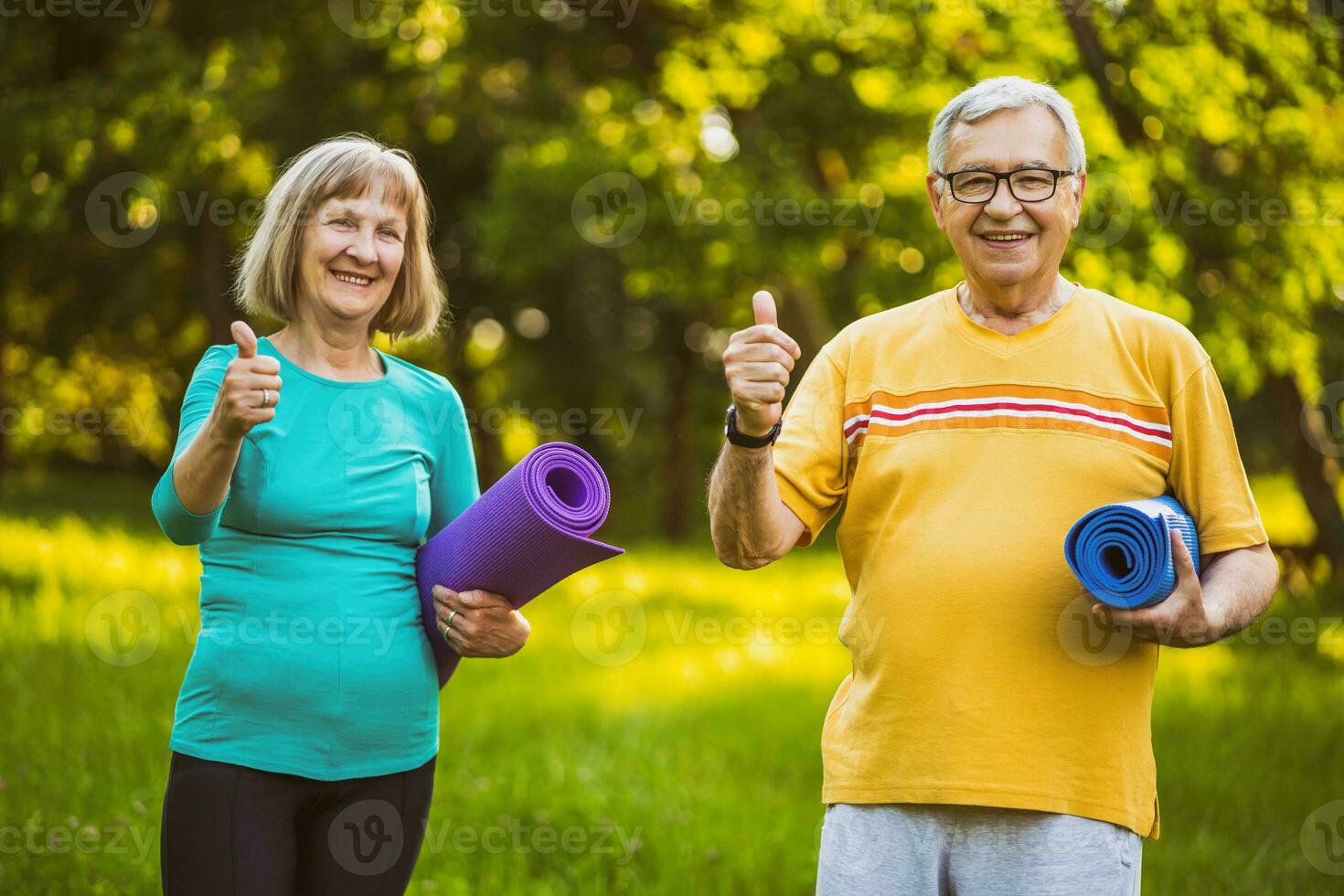 A senior couple doing physical exercises photo