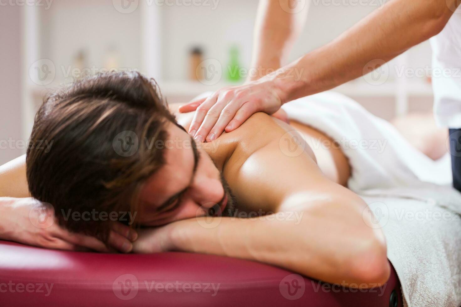 A man getting a back massage photo