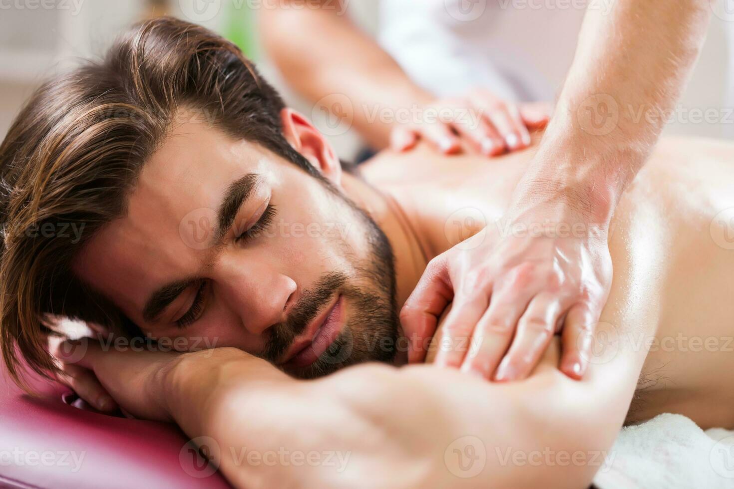 A man getting a back massage photo