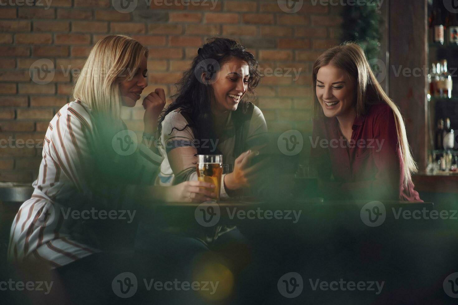 Friends having fun at the bar photo
