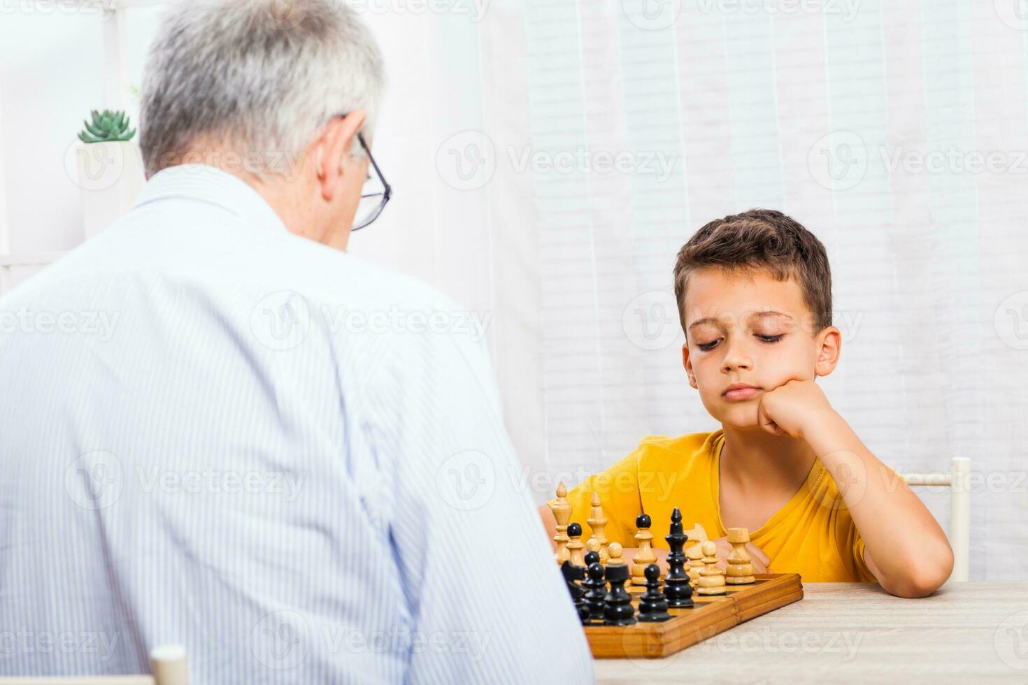 A grandfather spending time with his grandson photo