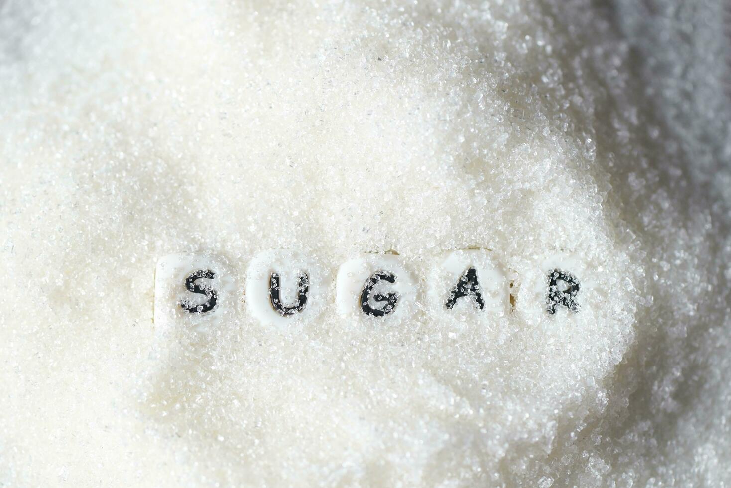 heap of sugar on background, white sugar for food and sweets dessert candy heap of sweet sugar crystalline granulated photo