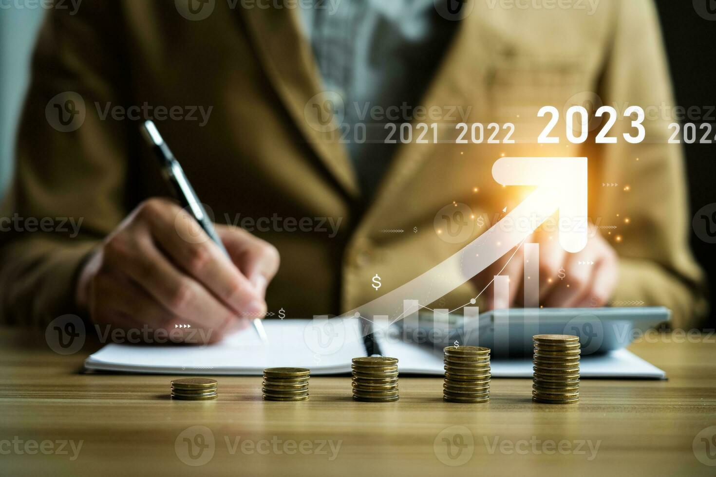 Interest rate and dividend concept, businessman calculating income and return on investment in 2023. income, return, retirement, compensation fund, investment,dividend tax,stock market, trend,strategy photo