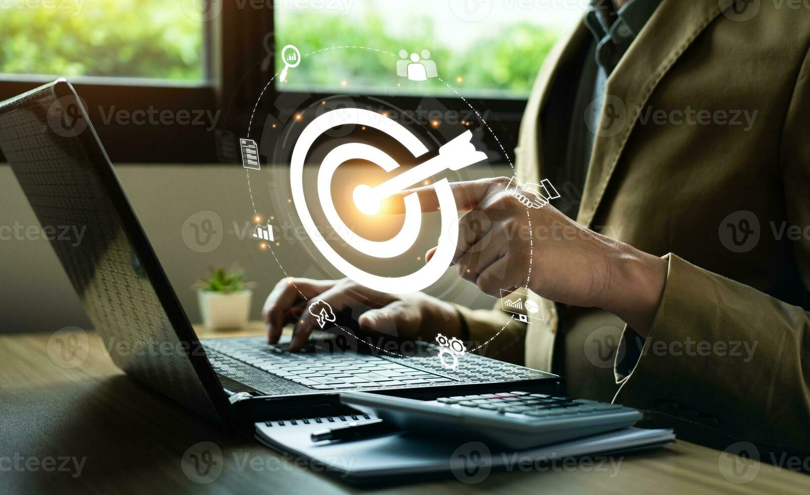 Business goals and marketing strategies. Businessman selecting target icon on laptop. economic analysis, Company strategy development, Manage and solve problems, success. business background photo