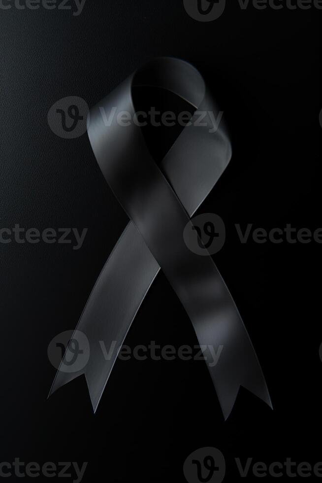 Black mourning ribbon with a dark background. photo