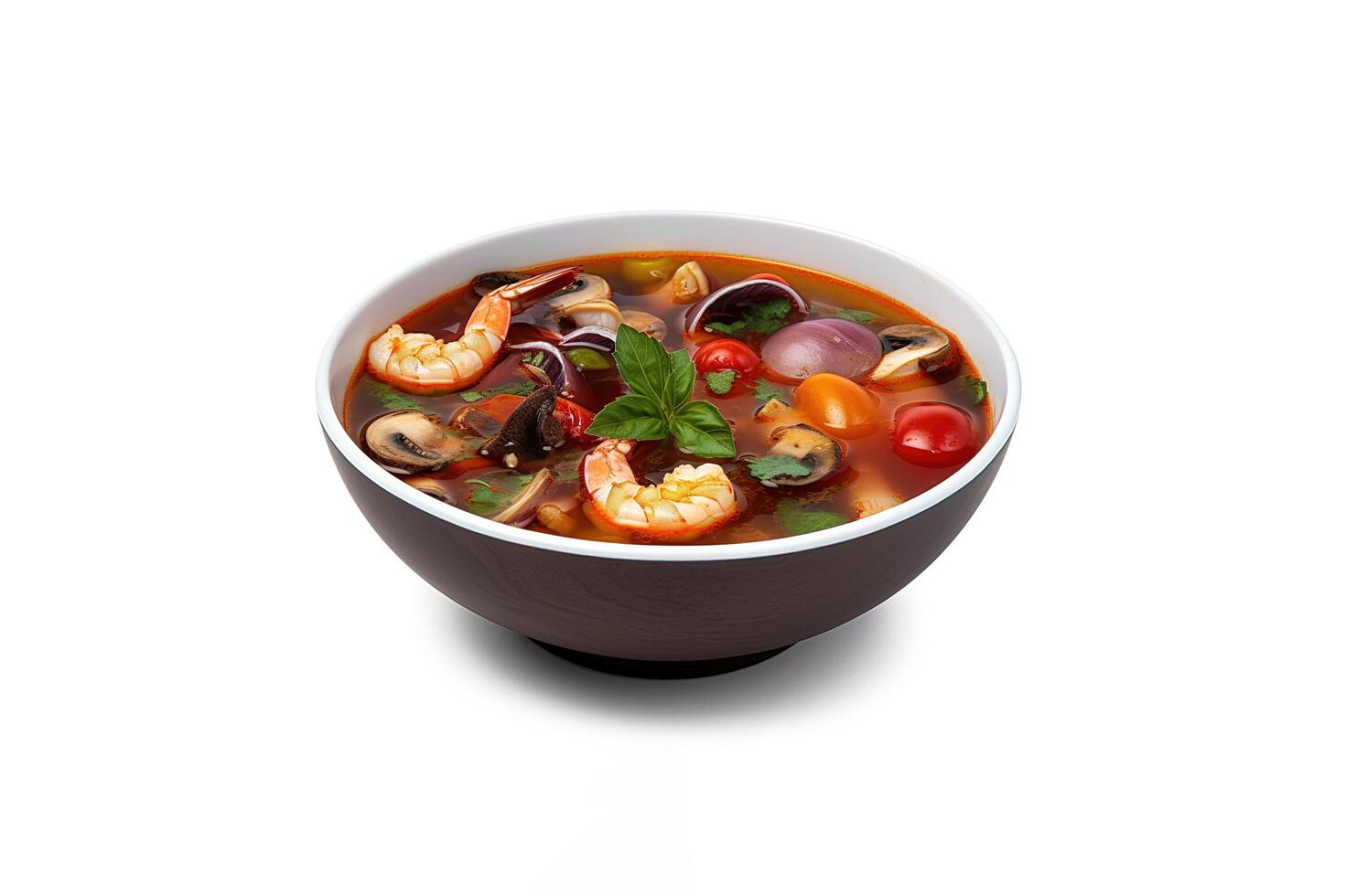 Delicious a bowl of Thai soup Tom Yam Kung with shrimps and clams isolated on white background. photo