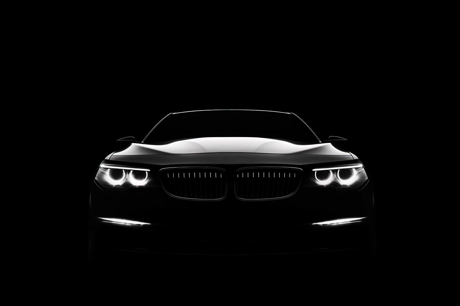 Front view dark silhouette of a modern luxury black car isolated on black background. photo