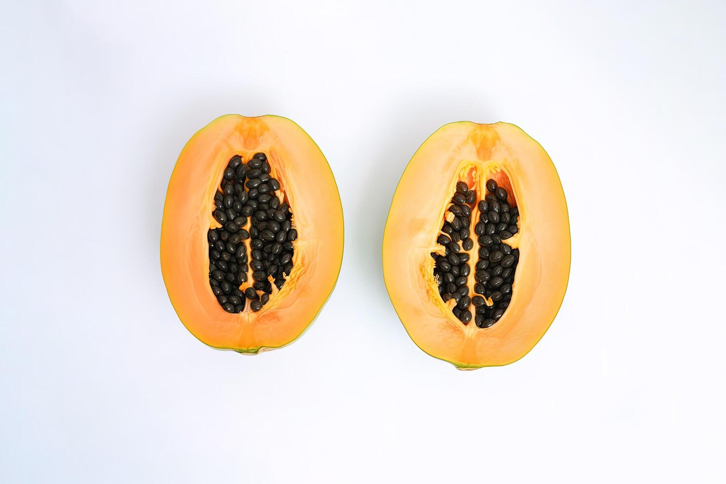 Top view fresh sliced papaya fruits isolated on white background. photo
