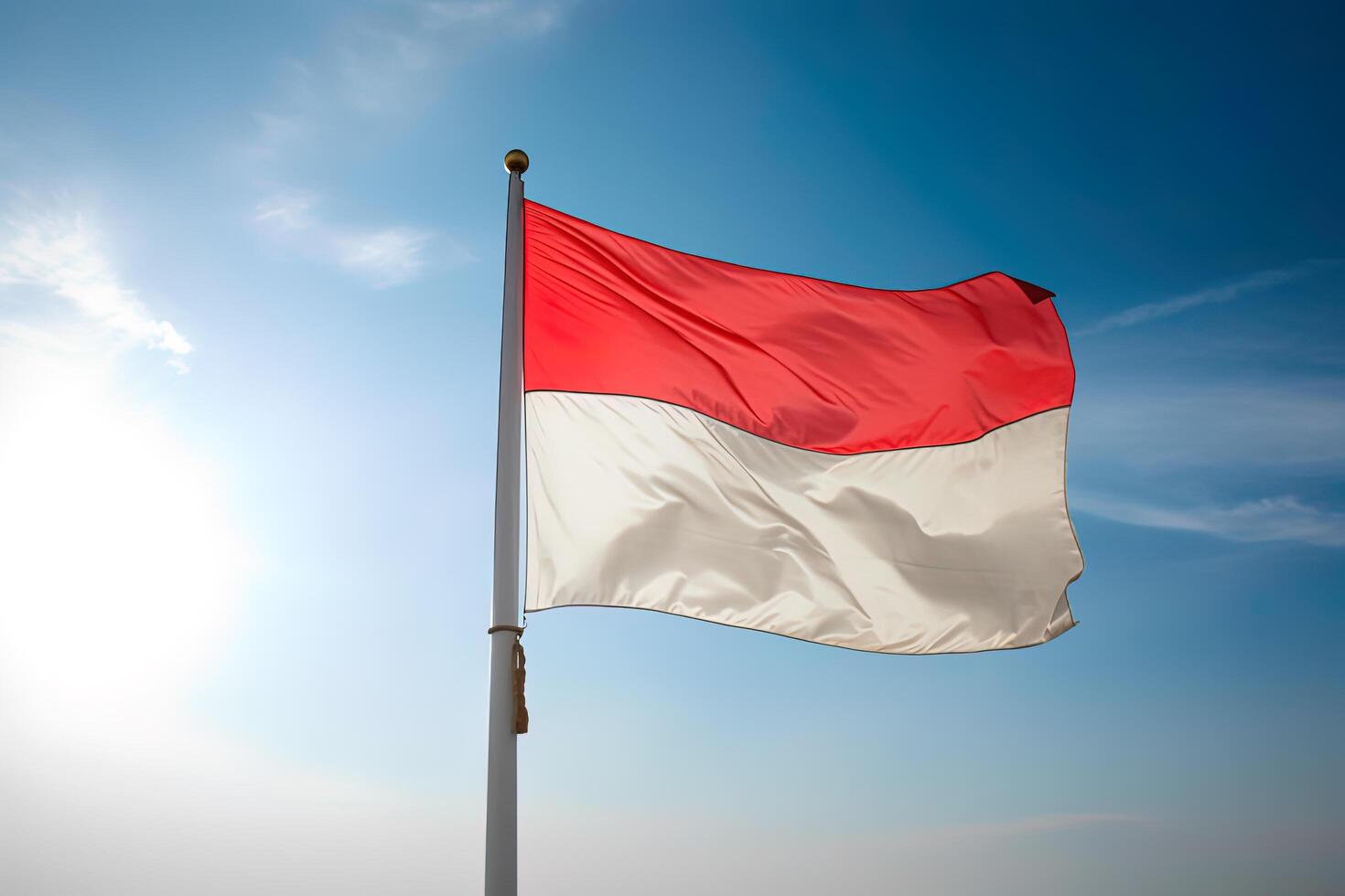 Indonesia nacional bandera ondulación en azul cielo. rojo y blanco bandera con nubes ai generado foto