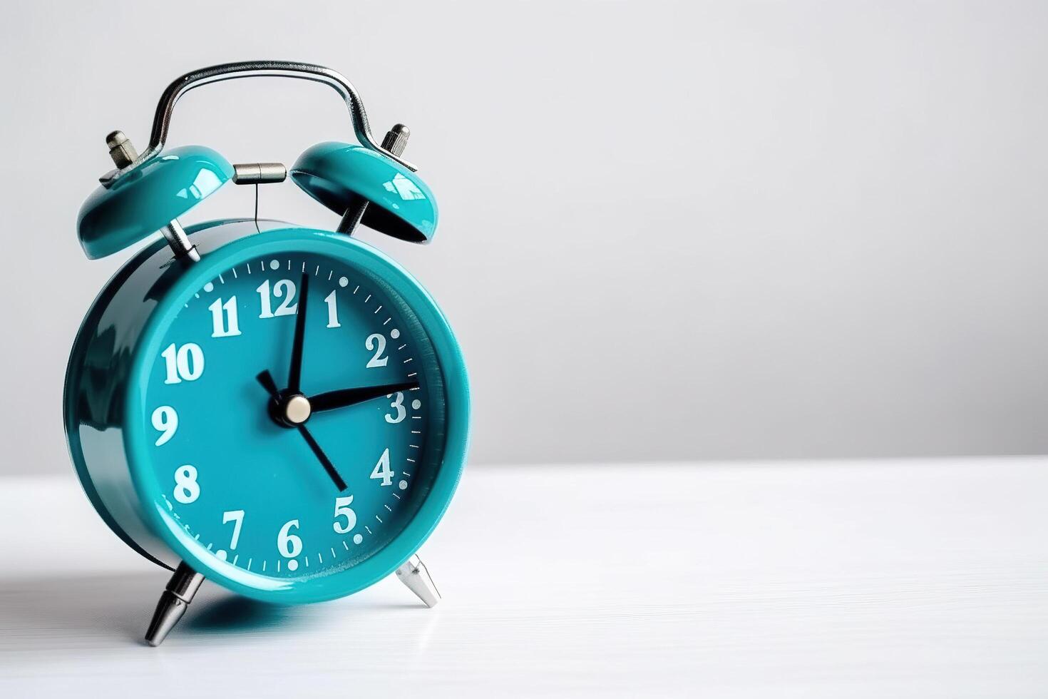 blue alarm clock on a white background. photo