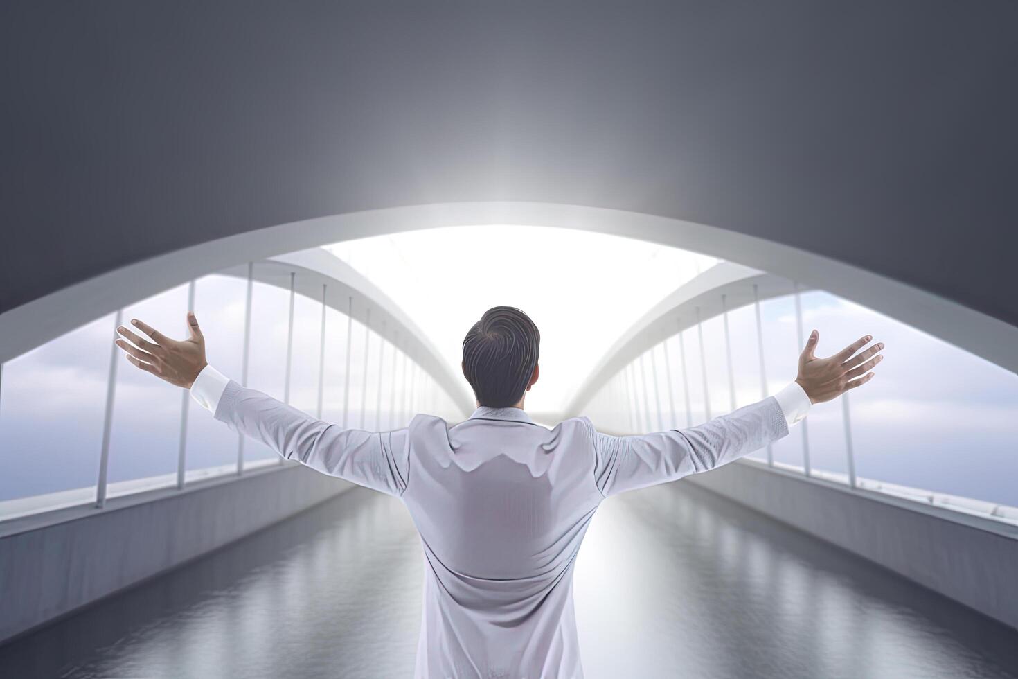 Successful businessman raising hand and expressing positivity while standing over the bridge. photo