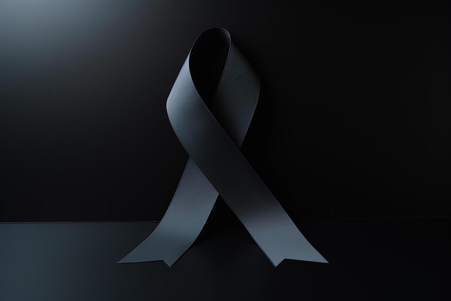 Black mourning ribbon with a dark background. photo