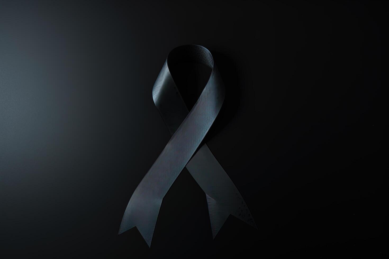 Black mourning ribbon with a dark background. photo