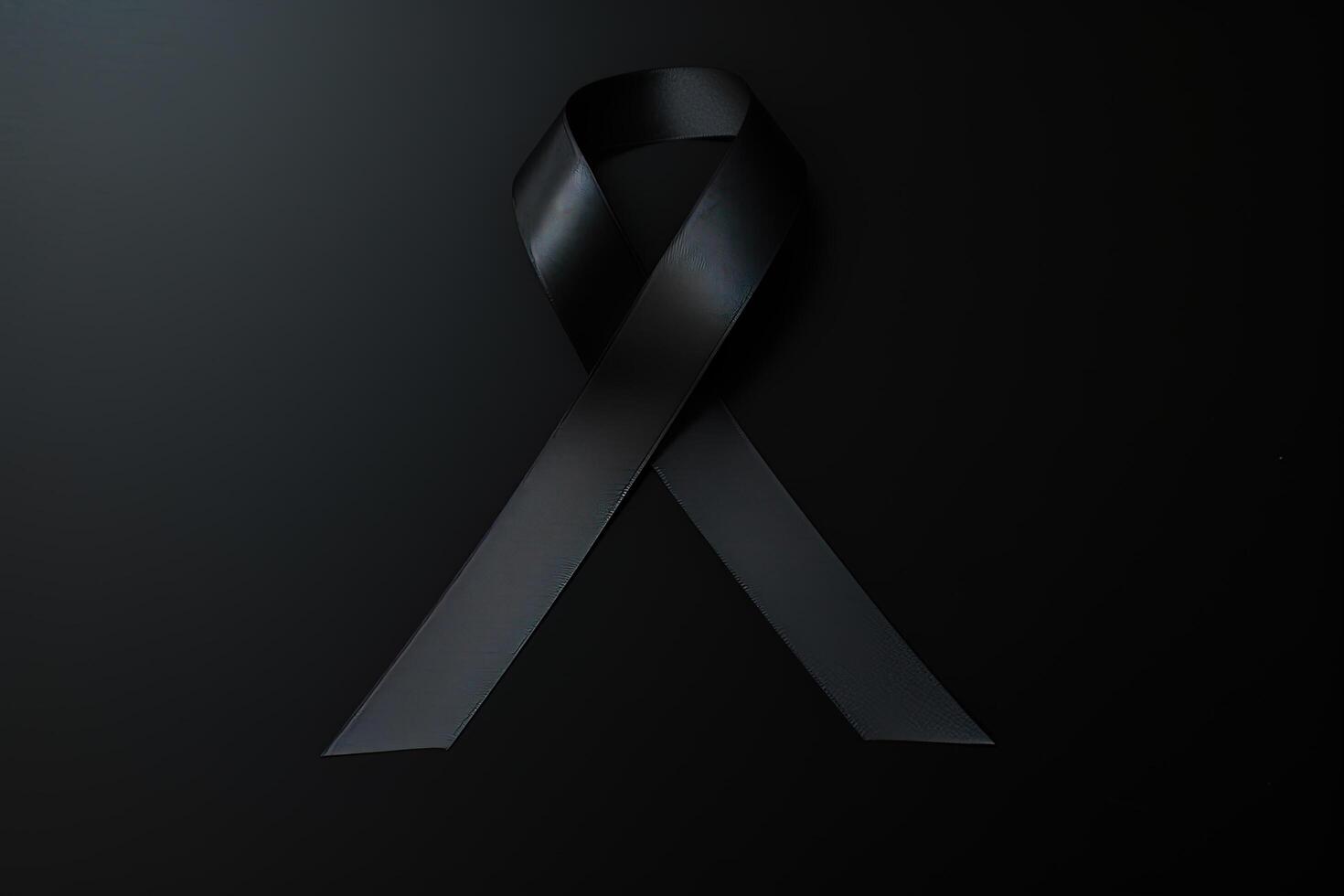 Black mourning ribbon with a dark background. photo