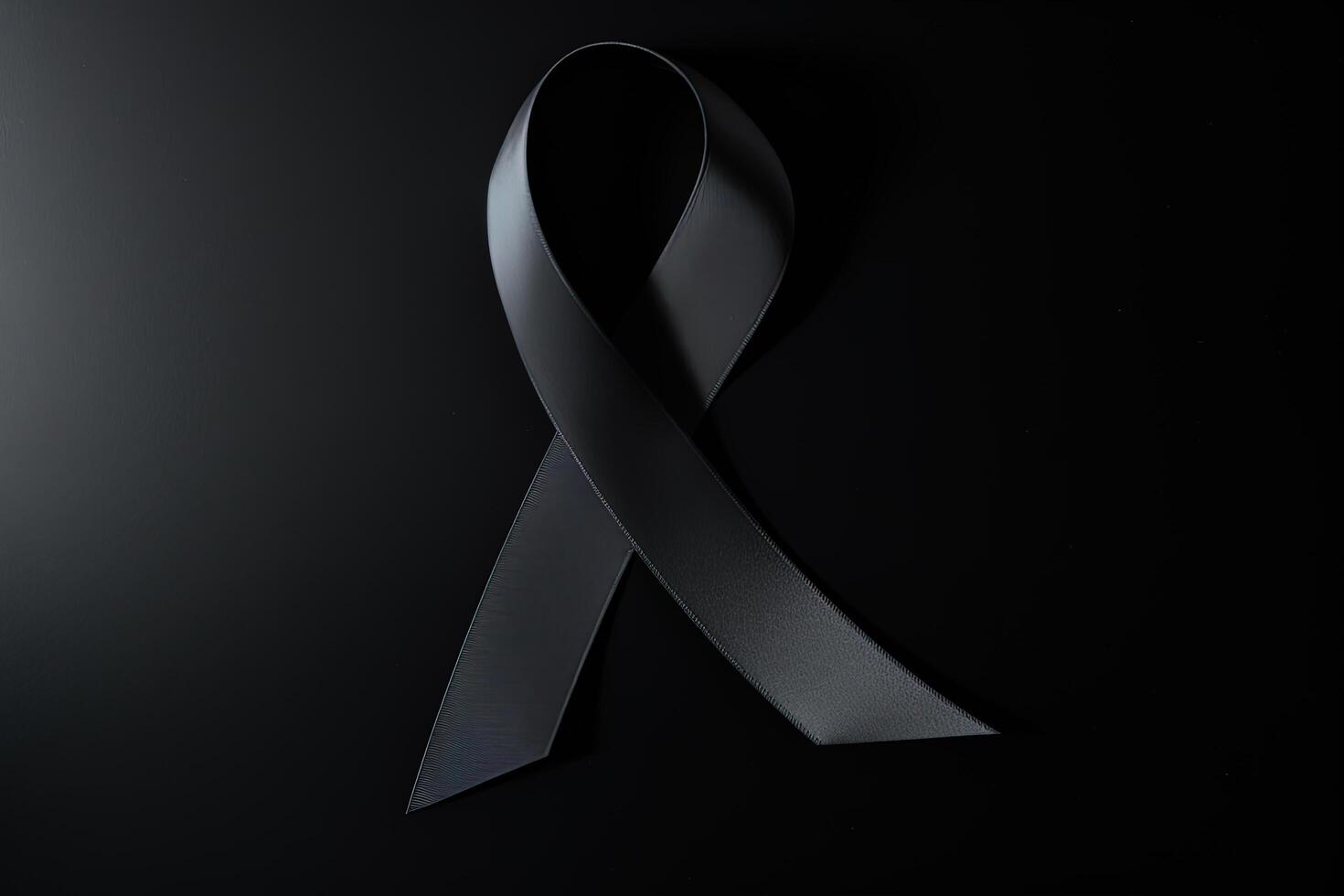 Black mourning ribbon with a dark background. photo