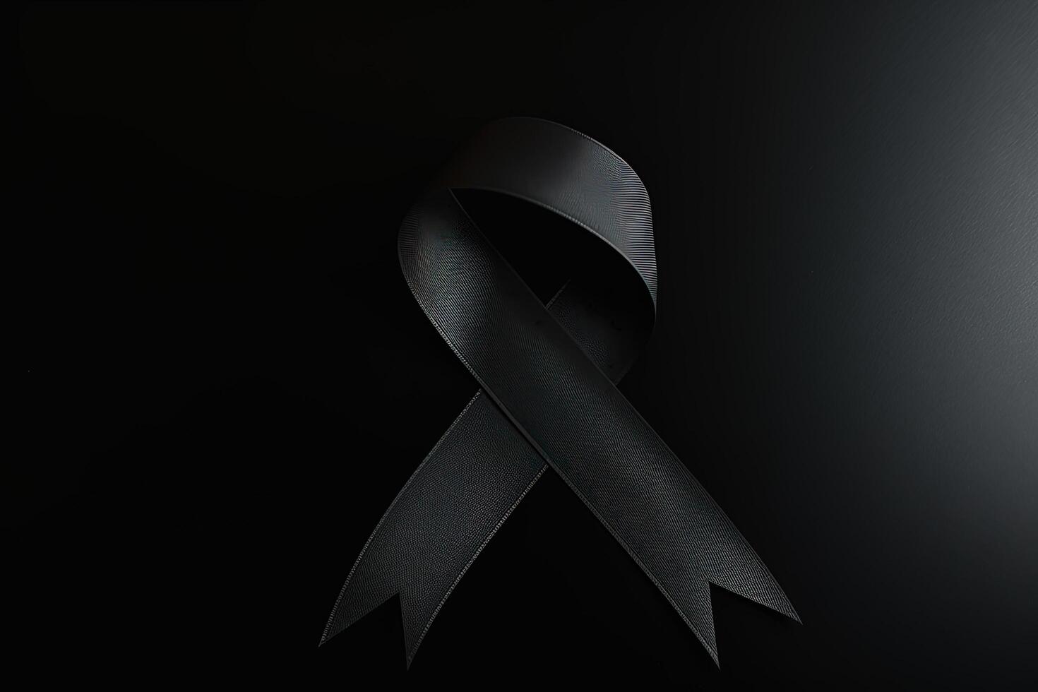 Black mourning ribbon with a dark background. photo