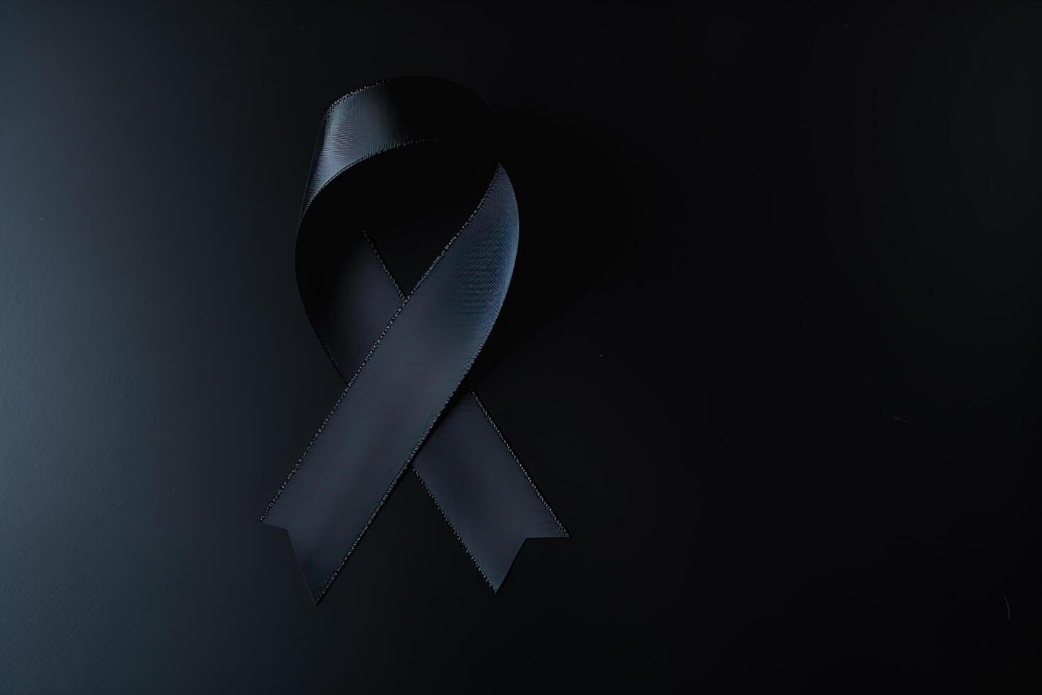 Black mourning ribbon with a dark background. photo