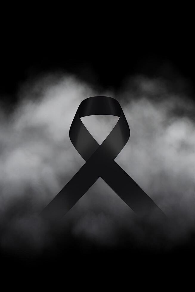 Black mourning ribbon with a dark smoke background. photo