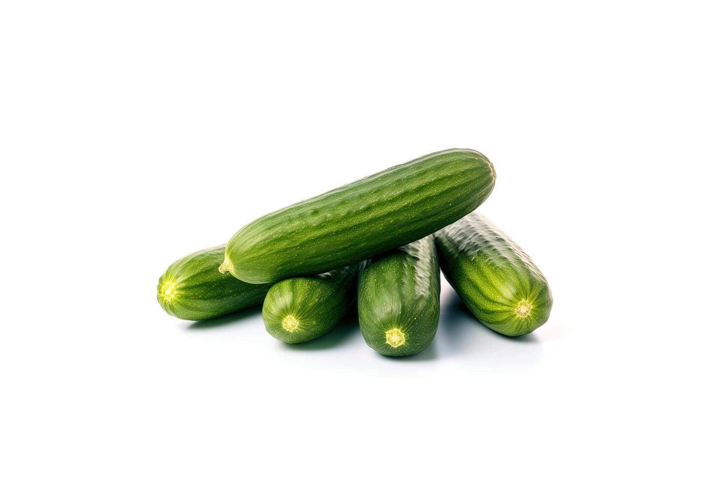 A pile of fresh green cucumbers isolated on white background. photo