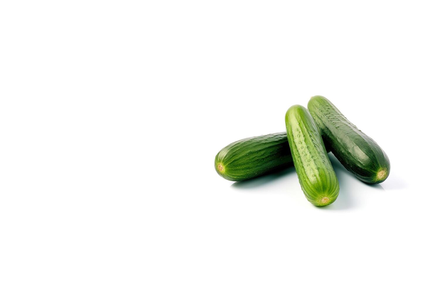 A pile of fresh green cucumbers isolated on white background with copy space. photo