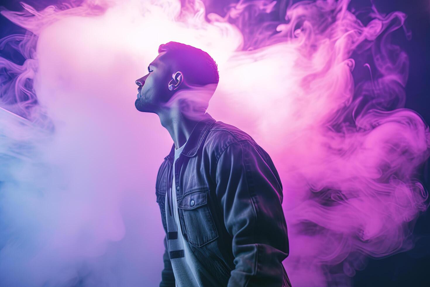 a man standing in front of a cloud of smoke with neon lights. photo