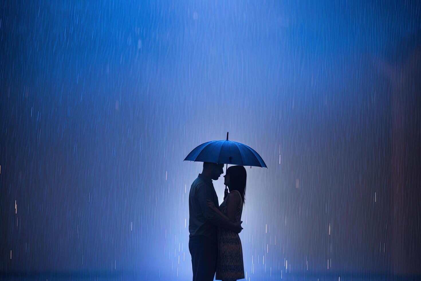 Silhouette a couple standing under an umbrella in the rain. photo