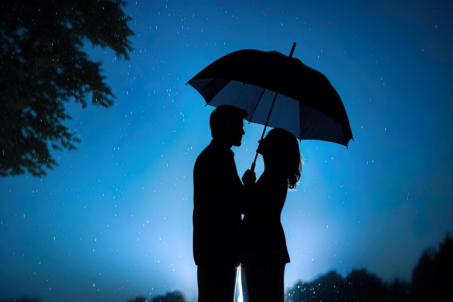 Silhouette a couple standing under an umbrella in the rain. photo