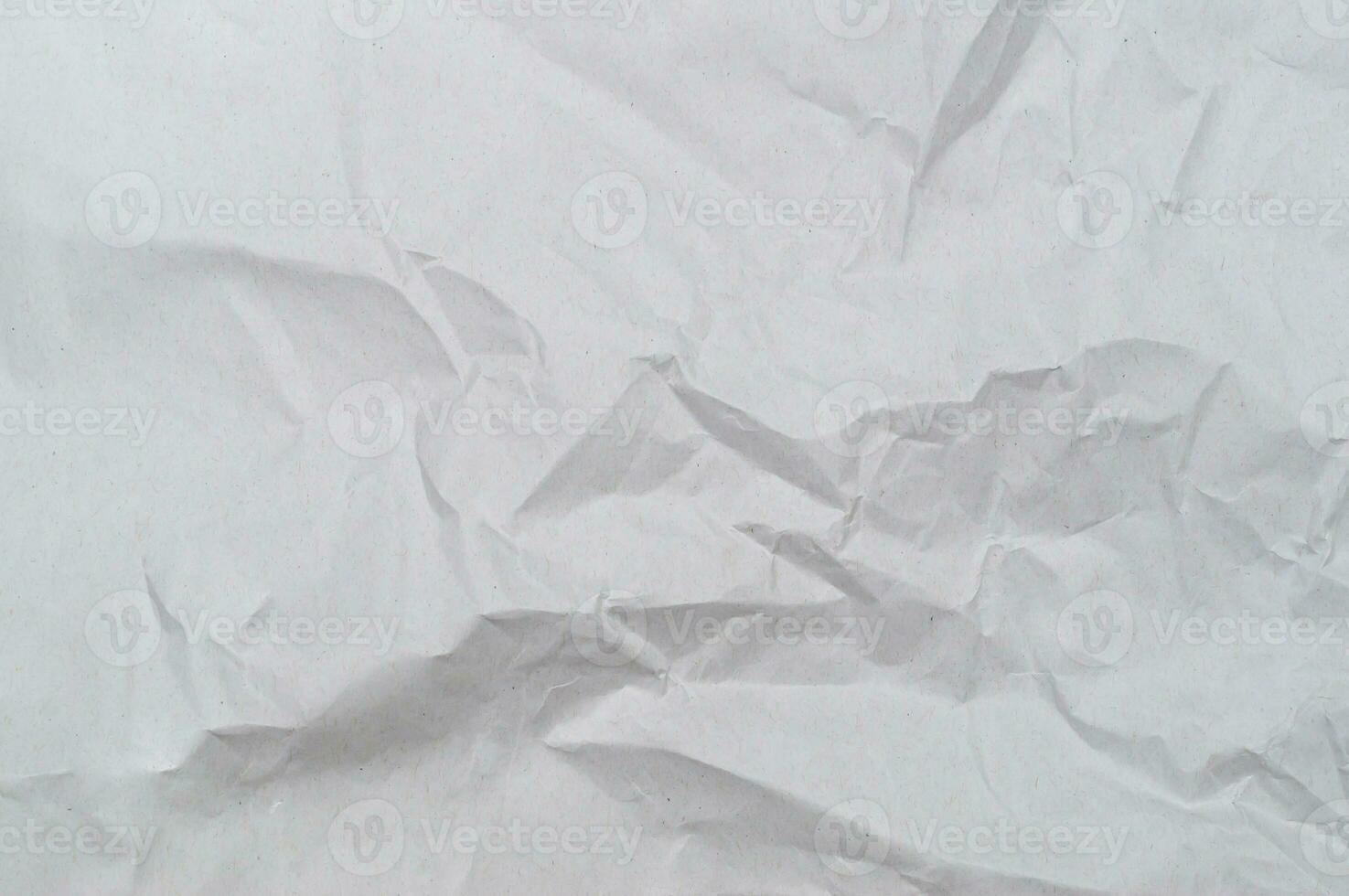 Wrinkled or crumpled white stencil paper or tissue after use in toilet or restroom with large copy space used for background texture in decorative art work photo