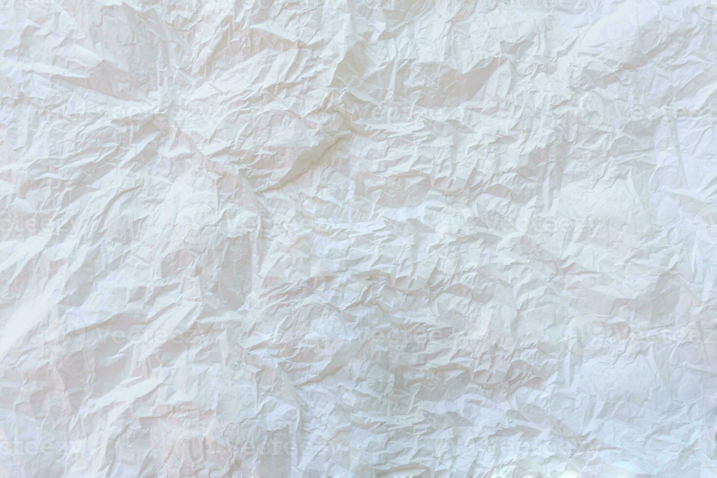 Wrinkled or crumpled white stencil paper or tissue after use in toilet or restroom with large copy space used for background texture in decorative art work photo