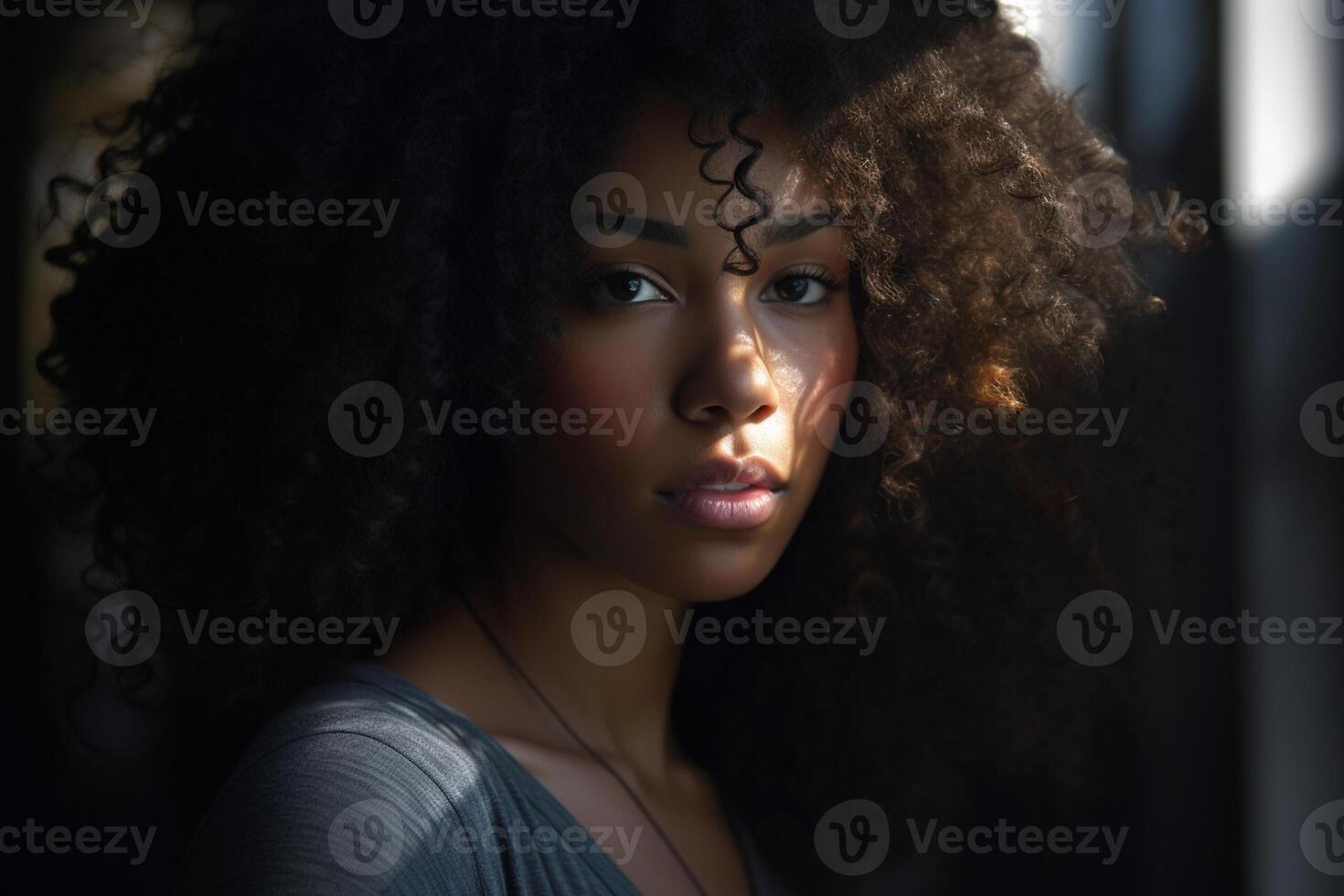 a black female with curly hair in the style of voluminous mass with photo