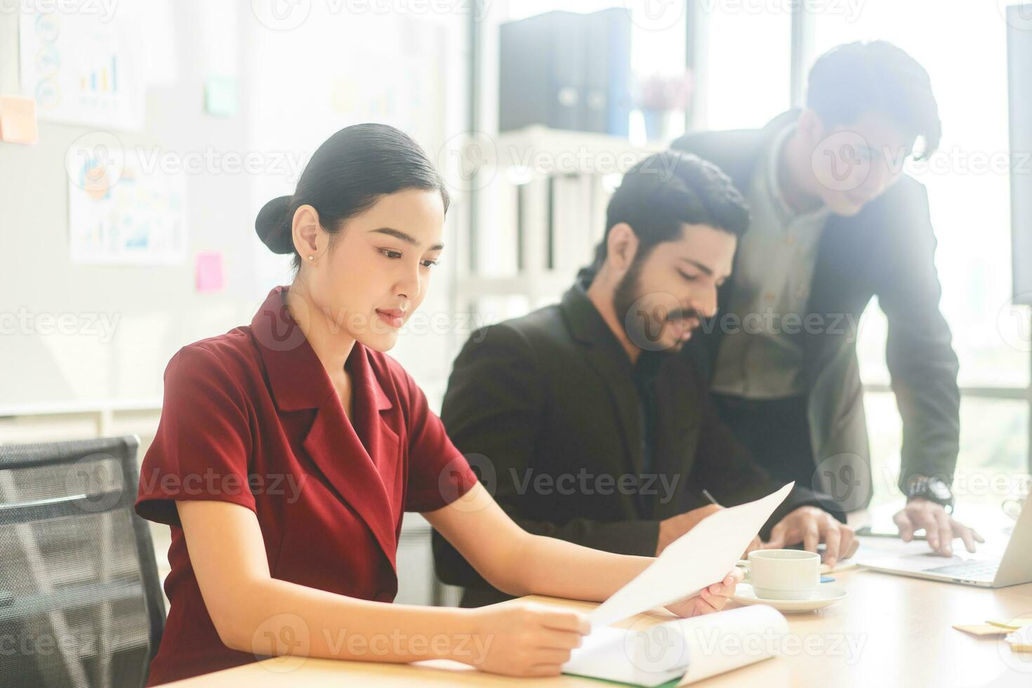 Young adult staff business woman reading document presentation data in meeting boardroom workplace photo