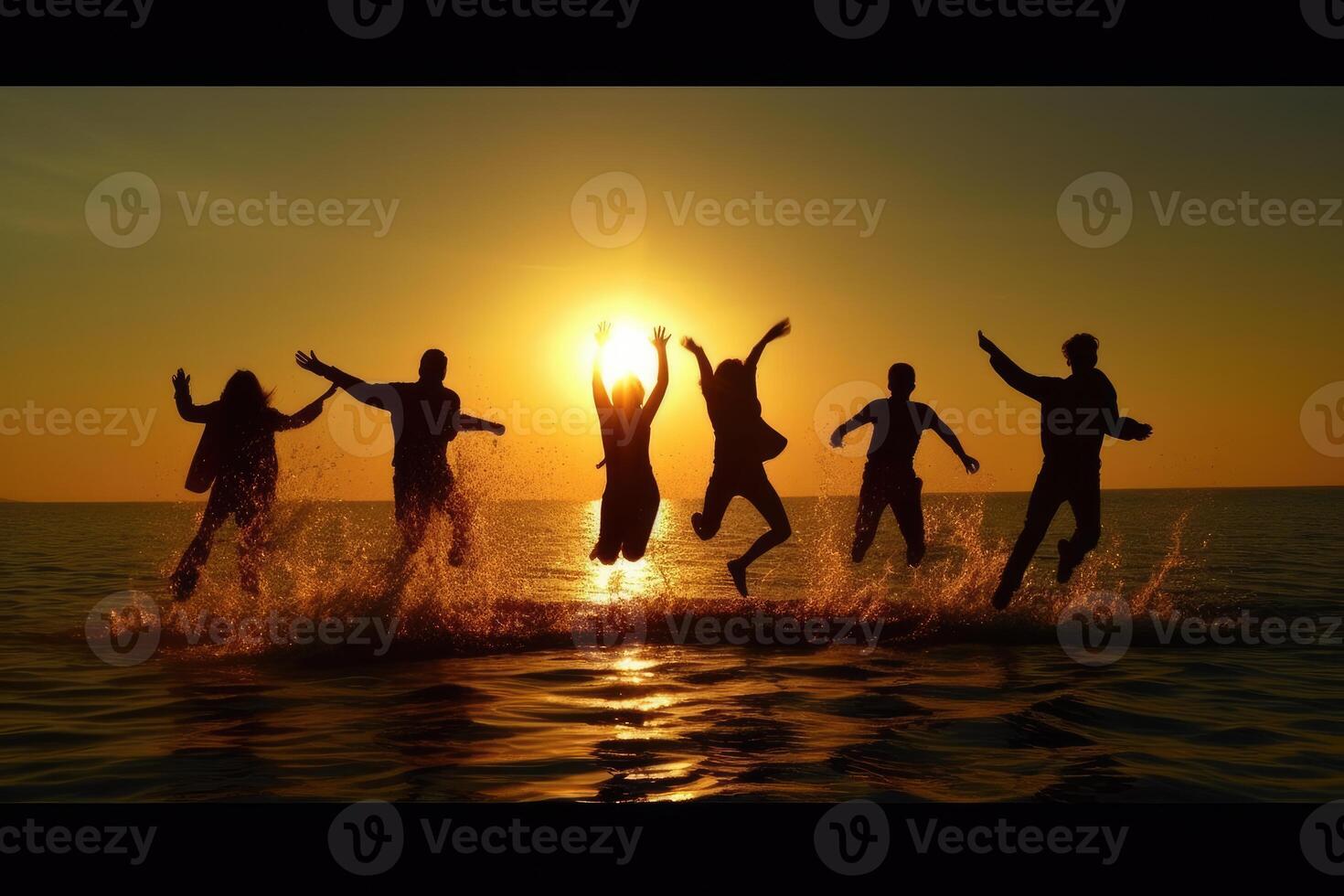 Young group of people jumping into the air at beach. photo