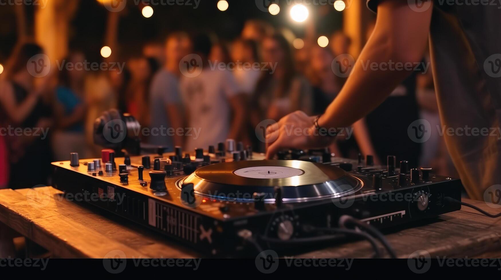 Dj playing music on a turntable in front of a crowd at festival, closeup photo. photo