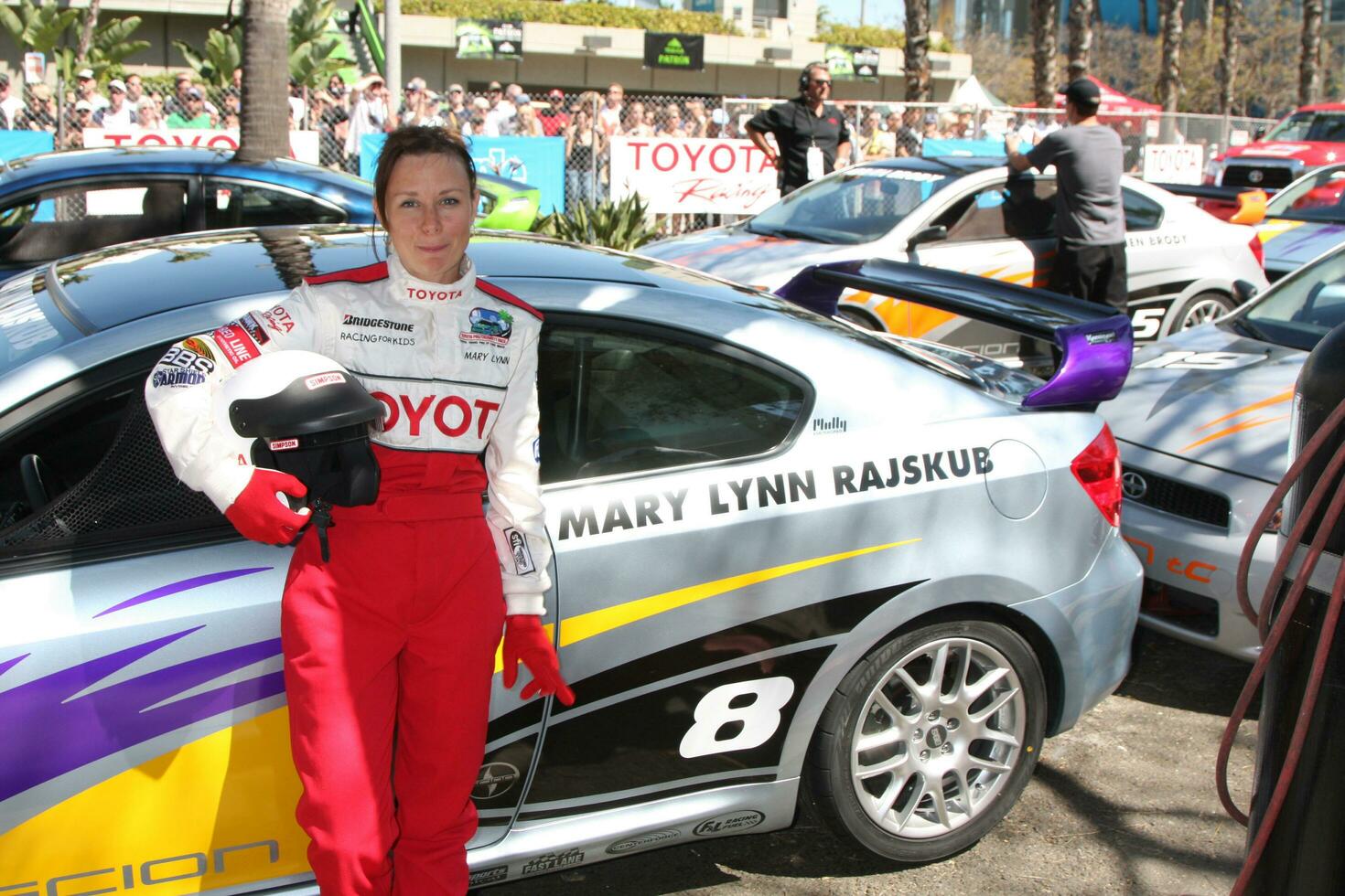 Mary Lynn Rajskub with her car at the Toyota ProCeleb Qualifying Day on April 17 2009 at the Long Beach Grand Prix course in Long Beach California 2009 Kathy Hutchins Hutchins Photo