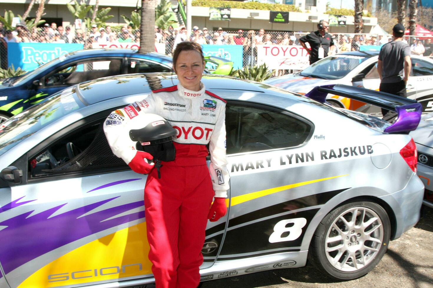 Mary Lynn Rajskub with her car at the Toyota ProCeleb Qualifying Day on April 17 2009 at the Long Beach Grand Prix course in Long Beach California 2009 Kathy Hutchins Hutchins Photo