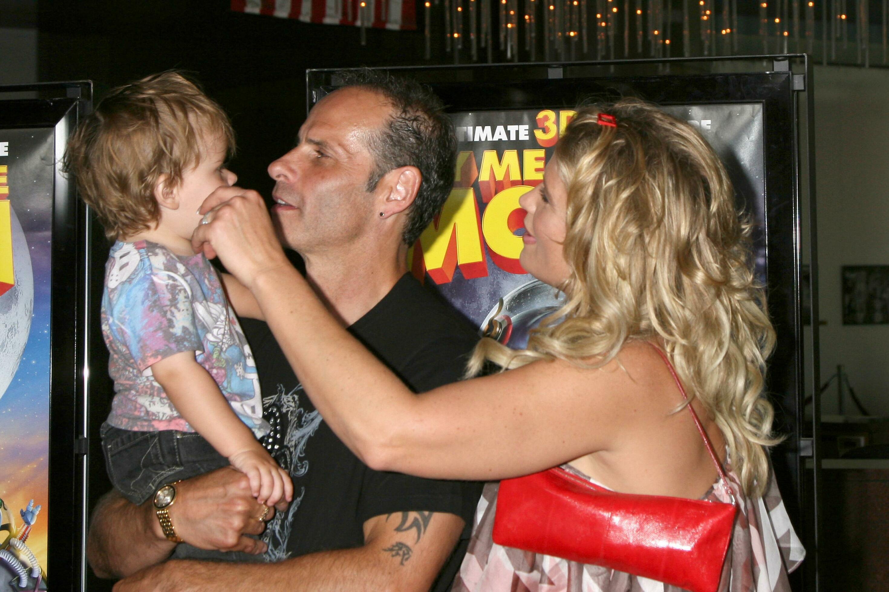 Lloyd Eisler Kristy Swanson with their son Magnus arriving at the