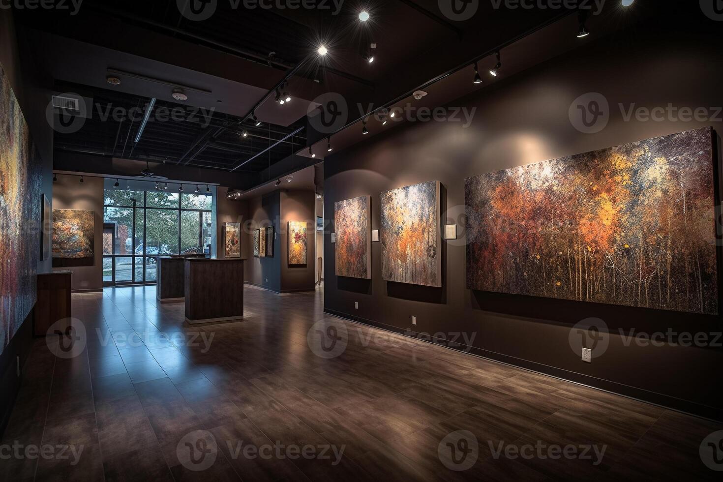 A gallery space with paintings on the walls and a wooden table with a sign that says'art. photo