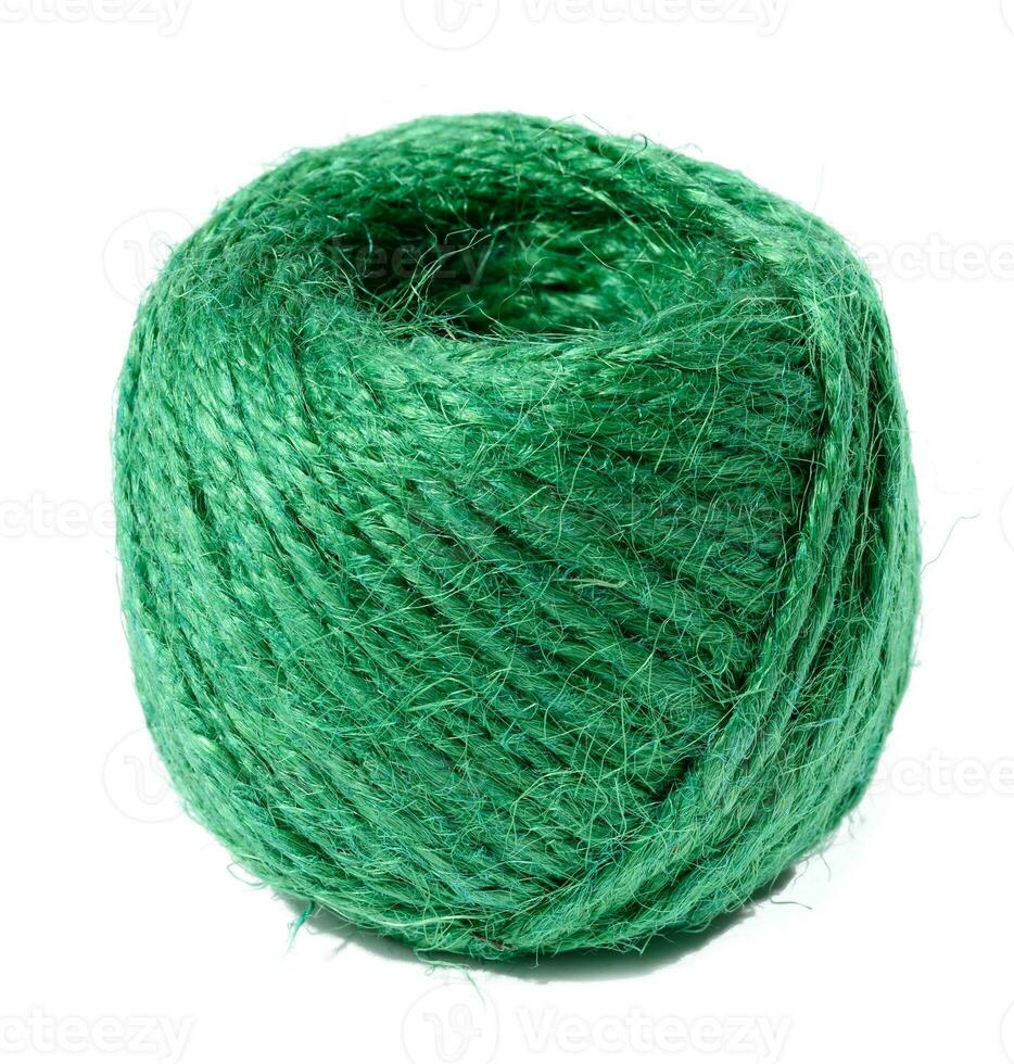 Skein of green and brown thread on a beige background Stock Photo by ndanko