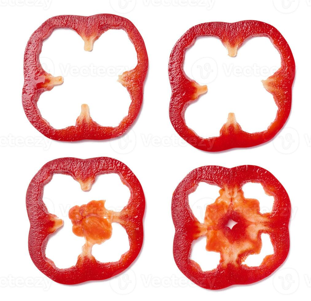 Various pieces of red bell pepper on a white isolated background photo