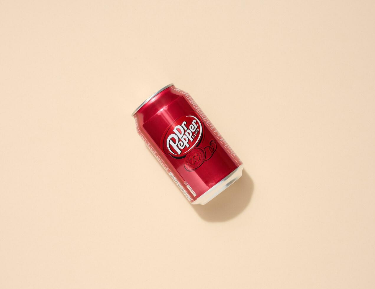 Mykolaiv, Ukraine May 6, 2023 Metal can of Dr. Pepper drink on a beige background, top view photo