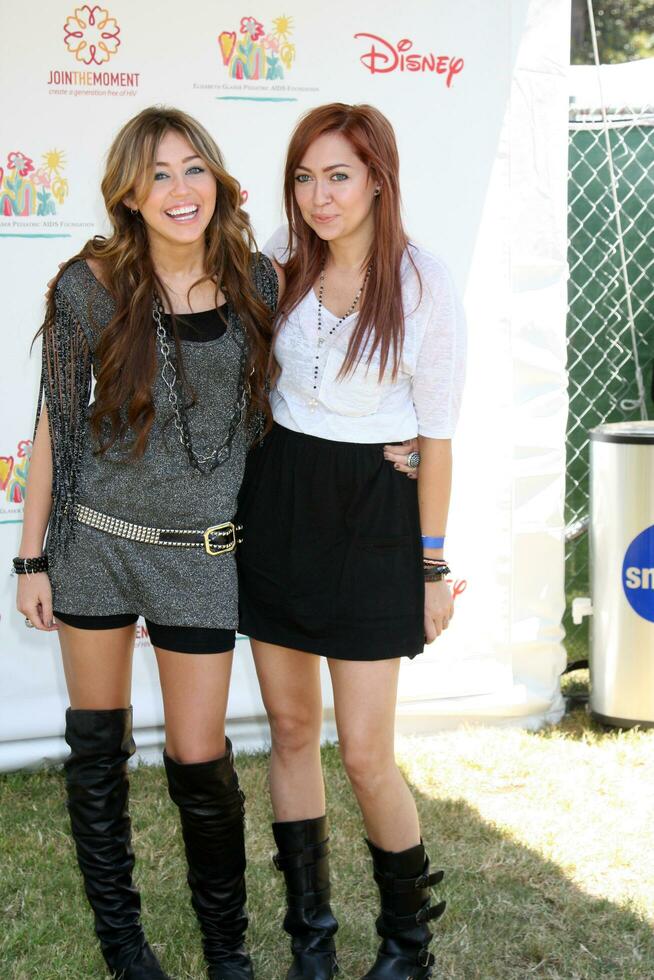 Miley Cyrus and Sister Brandi Cyrus arriving at the A Time For Heroes Celebrity Carnival benefiting the Elizabeth Glaser Pediatrics AIDS Foundation at the Wadsworth Theater Grounds in Westwood , CA on June 7, 2009 photo