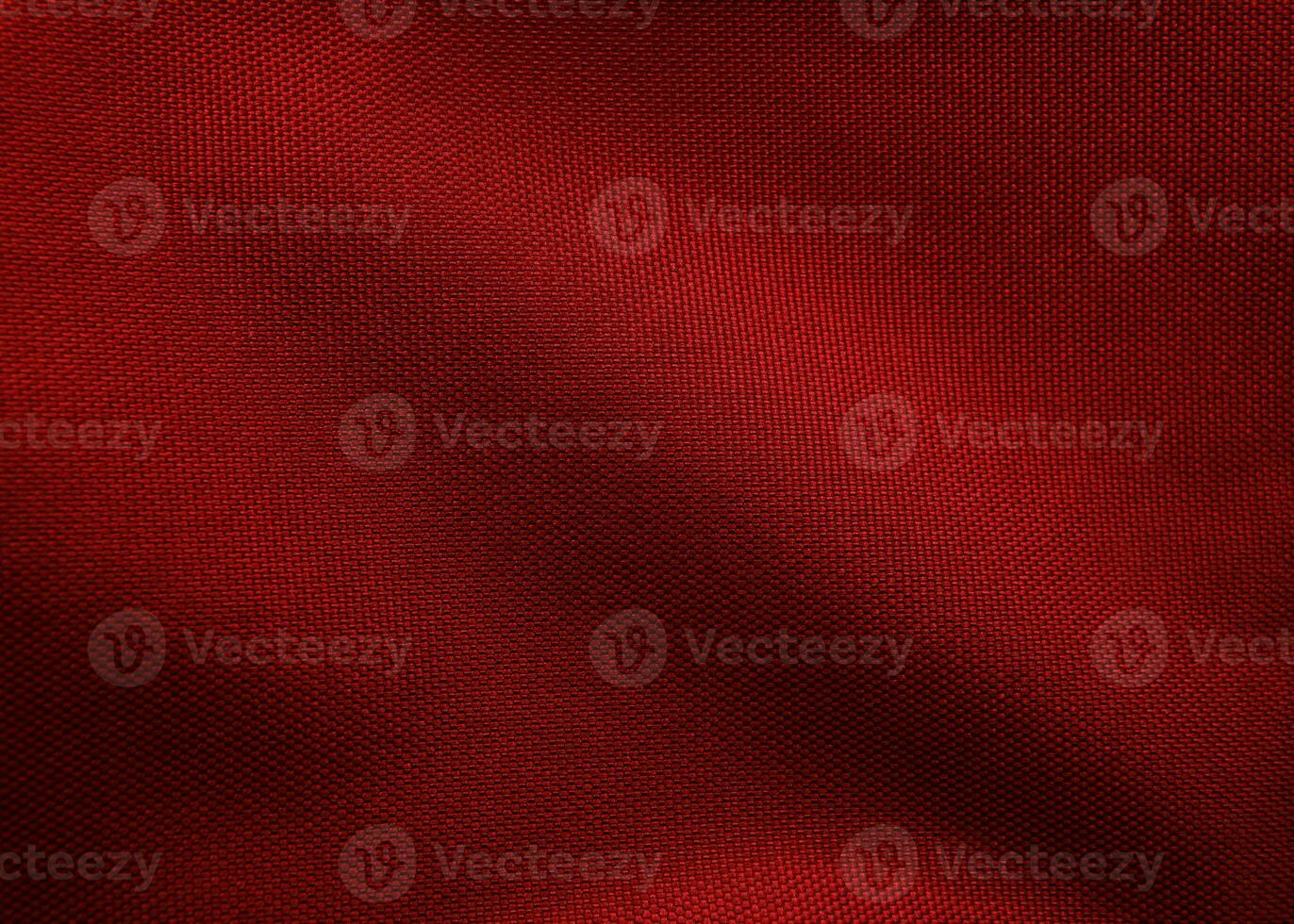 close-up of canvas texture for background and design , wrinkled pattern of  red fabric. photo