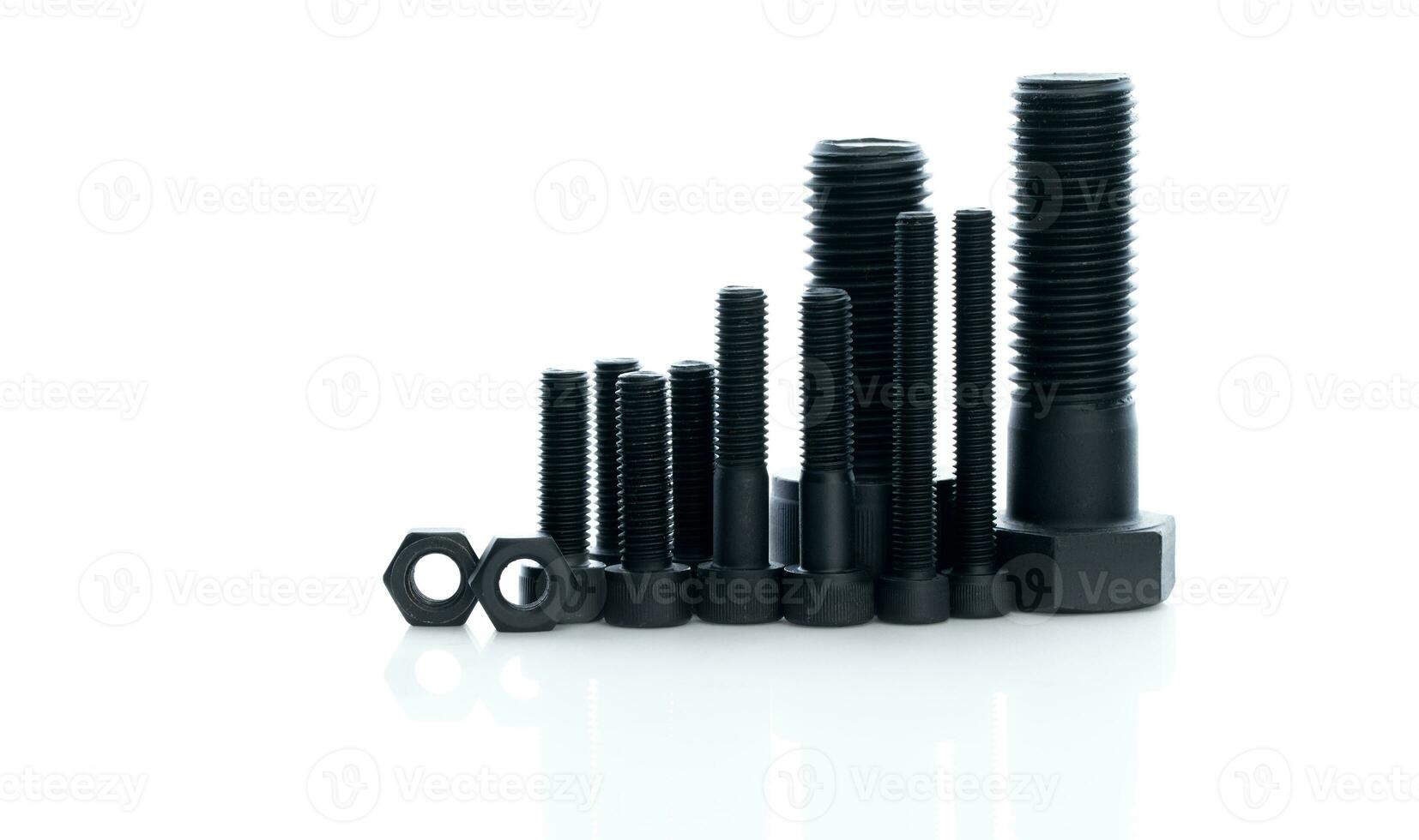 Black bolts and nuts isolated on white background. Industrial fasteners. Hardware tools. Stud bolt, hex nuts, and hex head bolts. Threaded fastener use in automotive engineering. Metal fasteners. photo